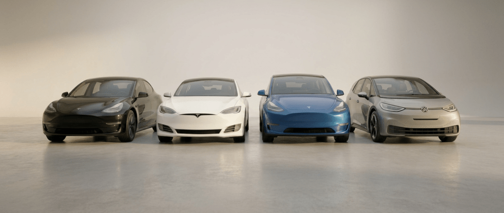 Blue Volkswagen ID.3 leading white and black Tesla Model 3 cars on a highway with mountain backdrop